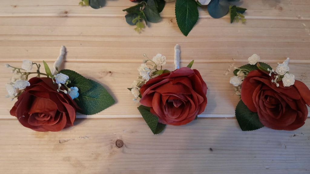 SEREN buttonholes with burnt orange roses