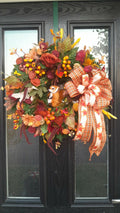Harvest Fox Autumn Wreath hanging on a black front door - full view