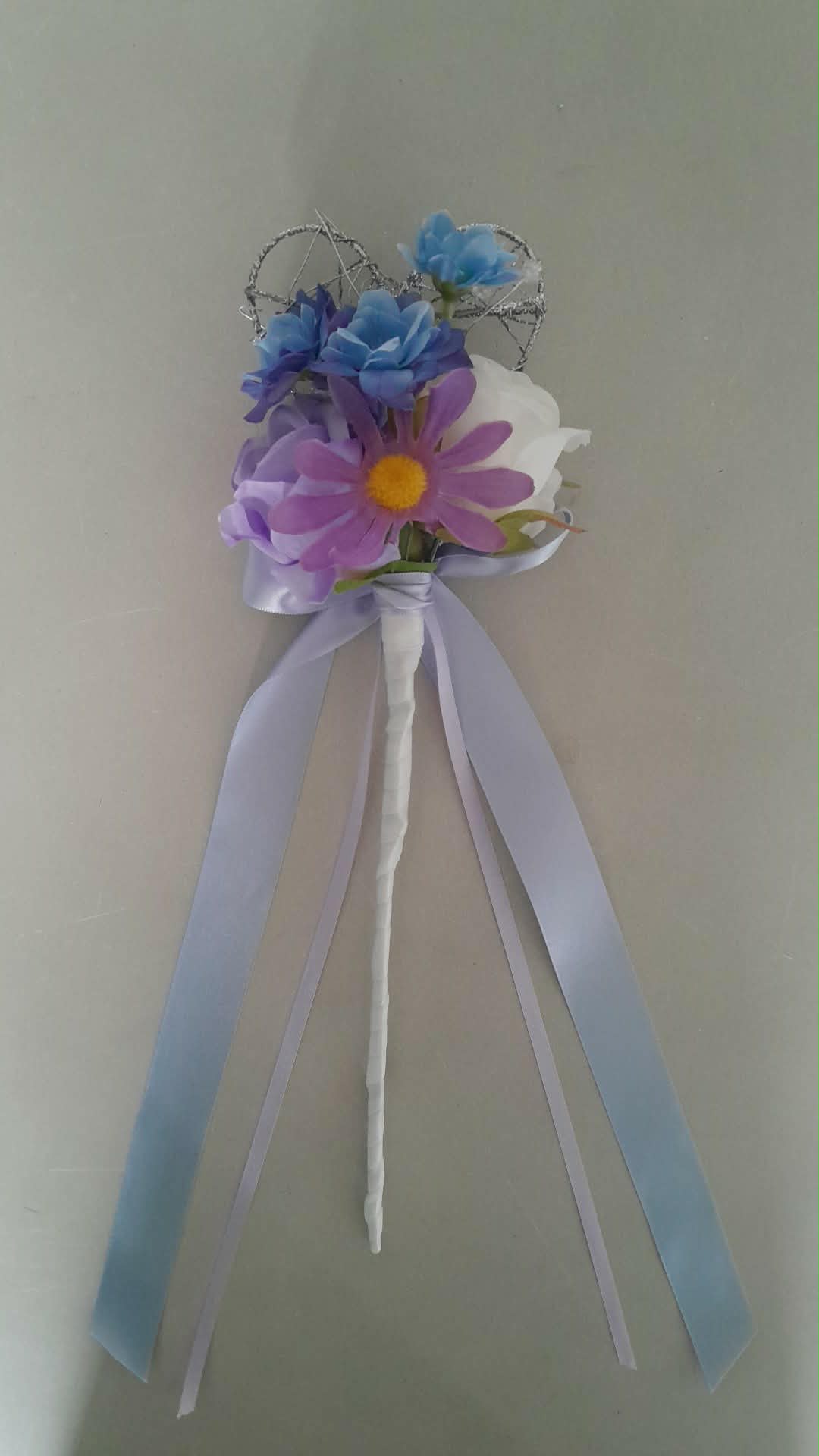 Thessaly cascading bridal bouquet close-up with blue roses, purple roses and white peonies