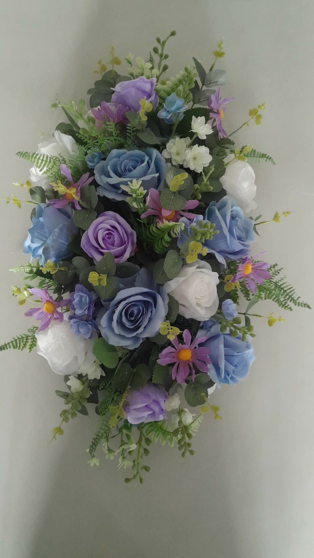 Thessaly teardrop bridal bouquet with blue, purple and white artificial roses