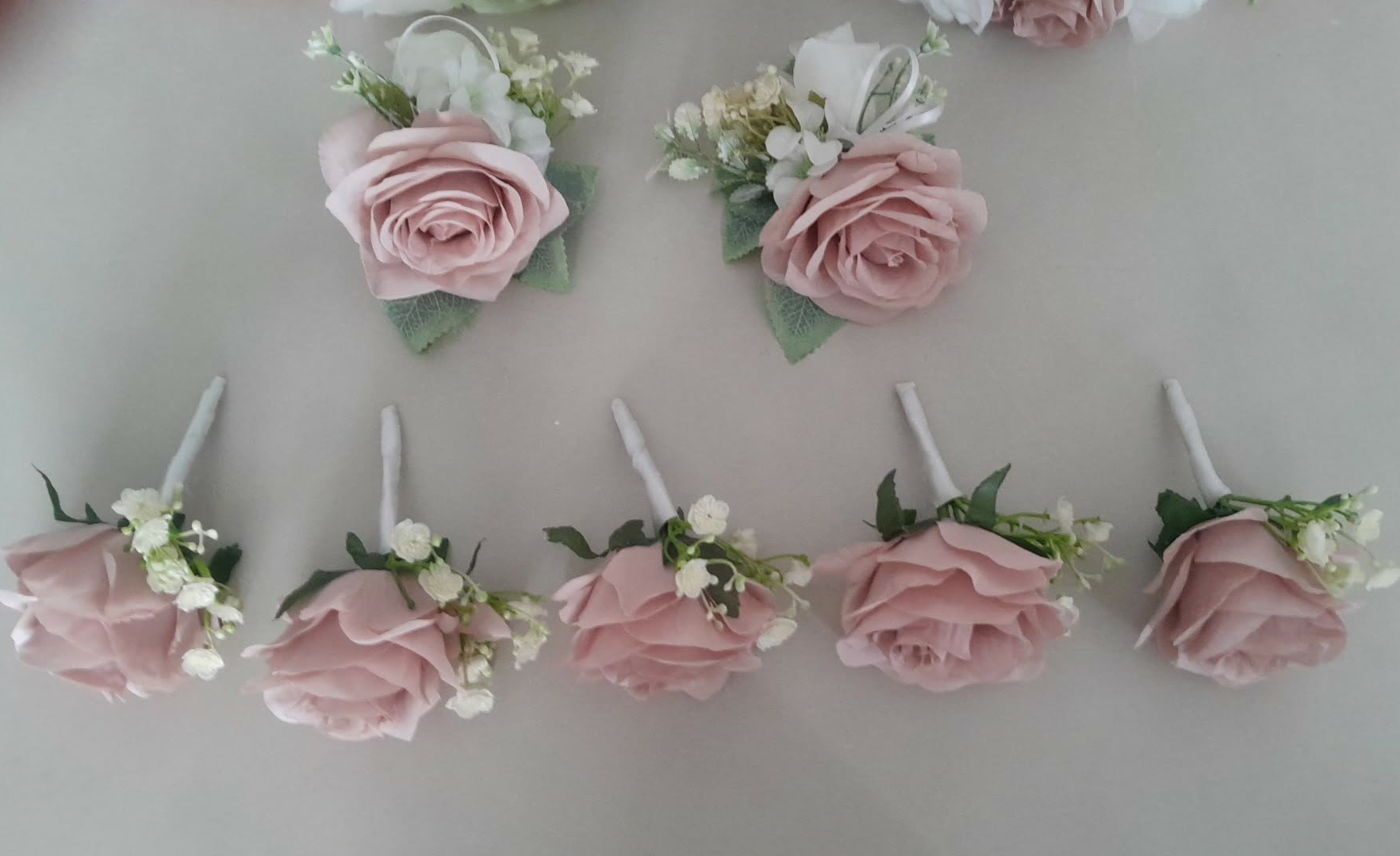 Freya collection dusky pink and sage green wrist corsages with gypsophila accents