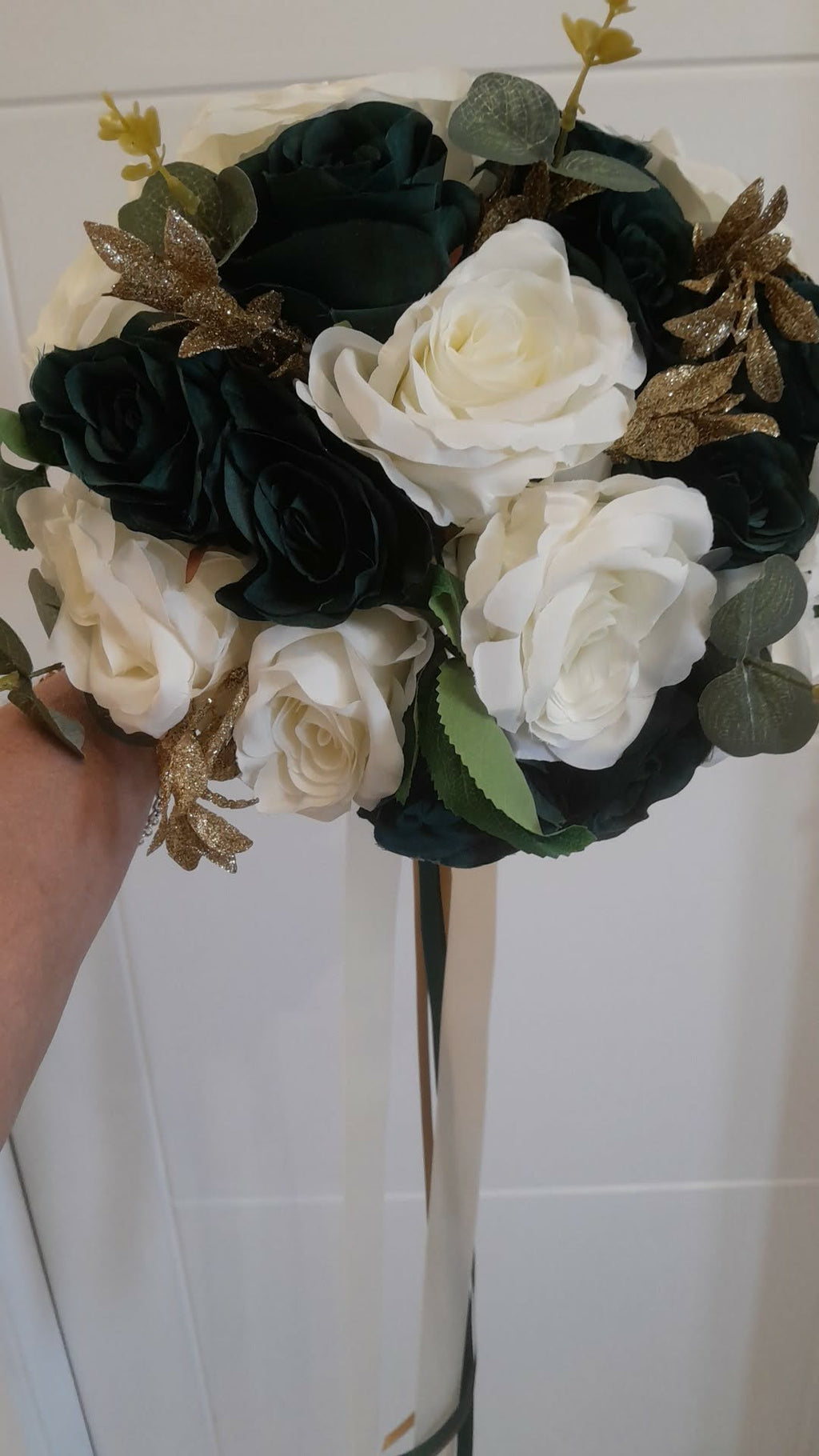 Isolde bridal bouquet close up showing dark green roses, ivory roses and gold glitter dragonfly accents