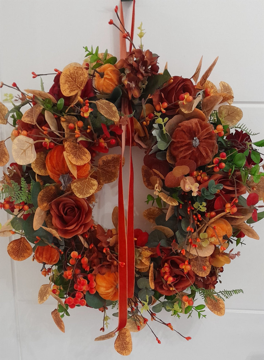 Autumn Harvest Wreath front door display with red velvet ribbon