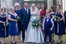 Araminta bridal bouquet at real wedding - deep burgundy and ivory roses with cascading eucalyptus, confetti falling