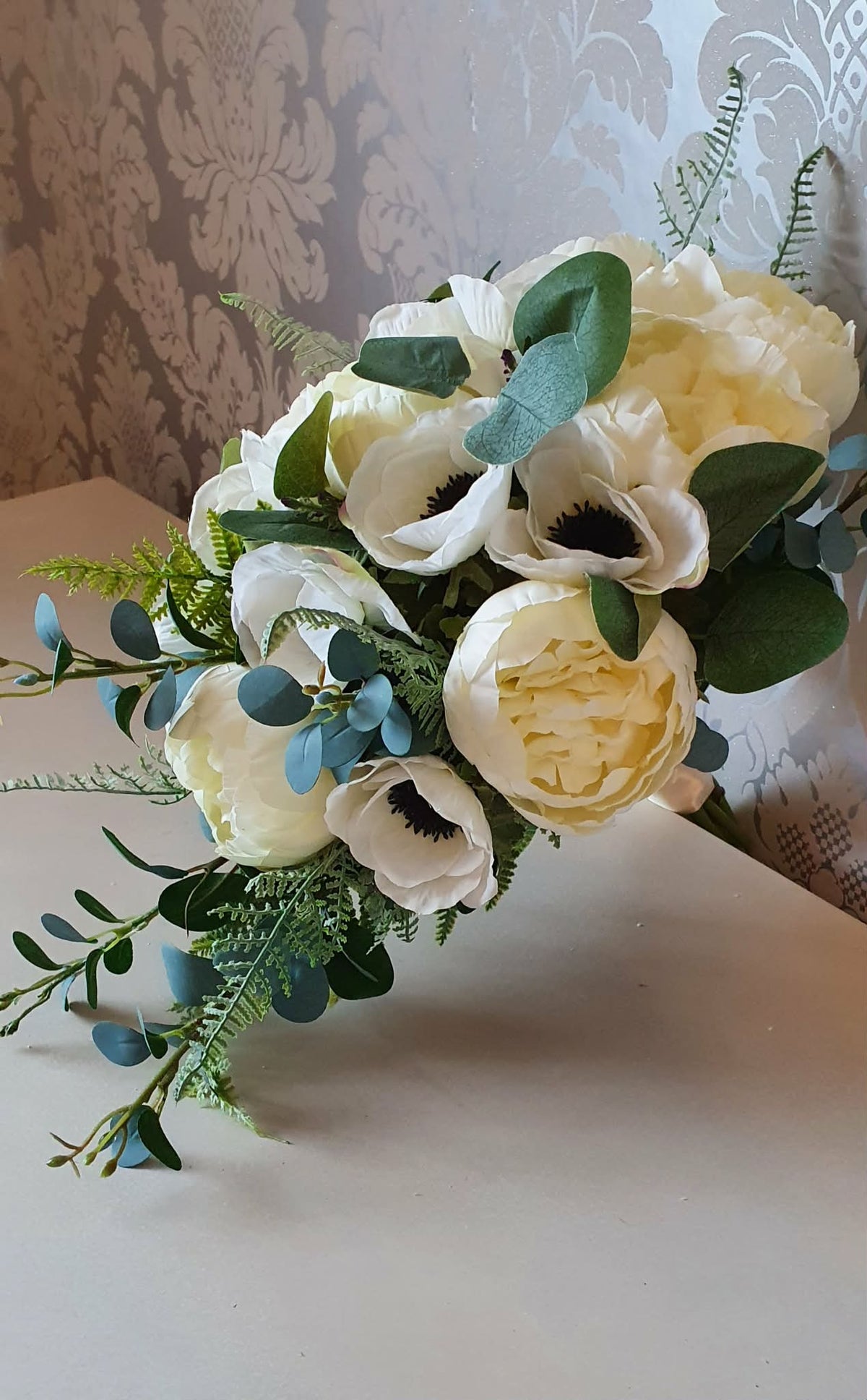 Thessaly cascading bridal bouquet — side profile showing cascading teardrop silhouette