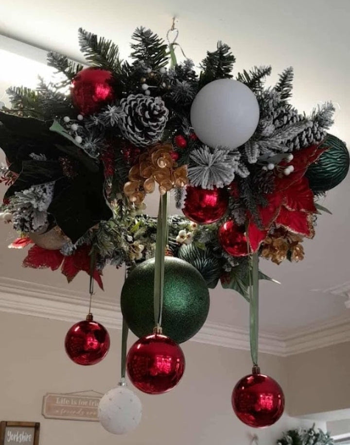 50cm Christmas hanging chandelier ceiling decoration with frosted pine, red poinsettias, large red green and white baubles on ribbons and frosted pine cones