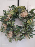 Mixed foliage and thistle wreath 50cm base