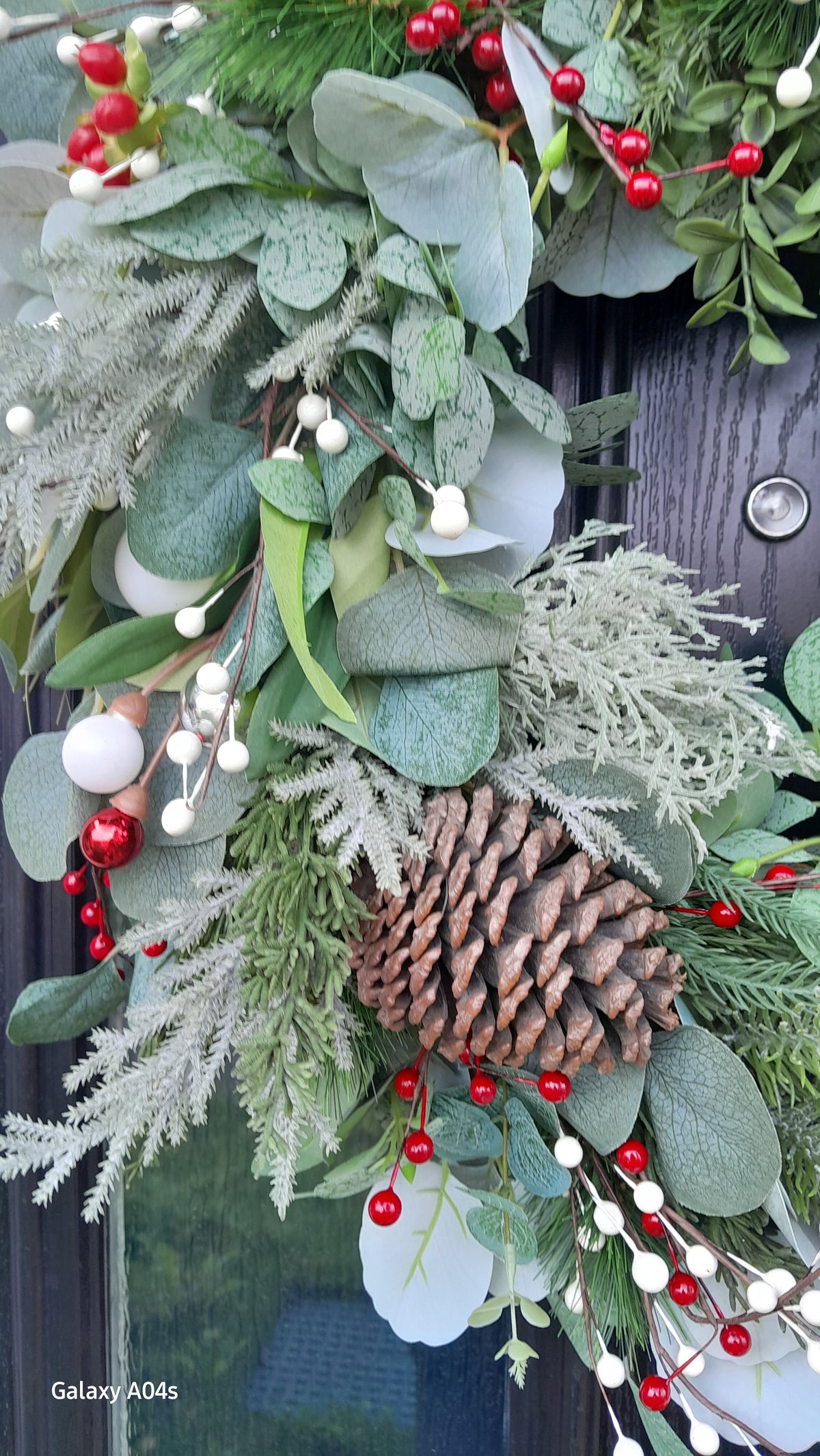 Winter Botanicals Christmas Wreath - full view on dark door