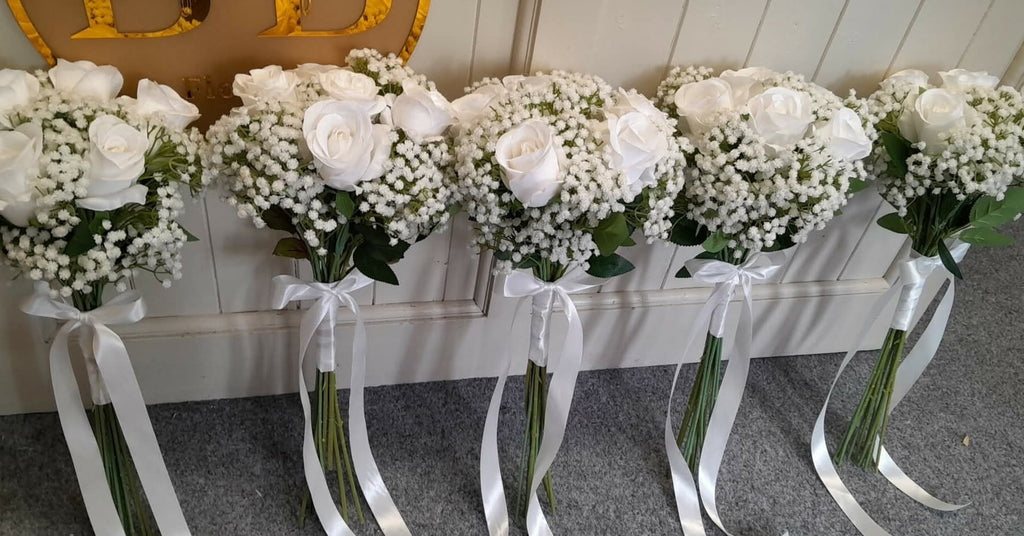 Ottilie bridesmaid bouquet close up - white roses, gypsophila and white ribbon bow