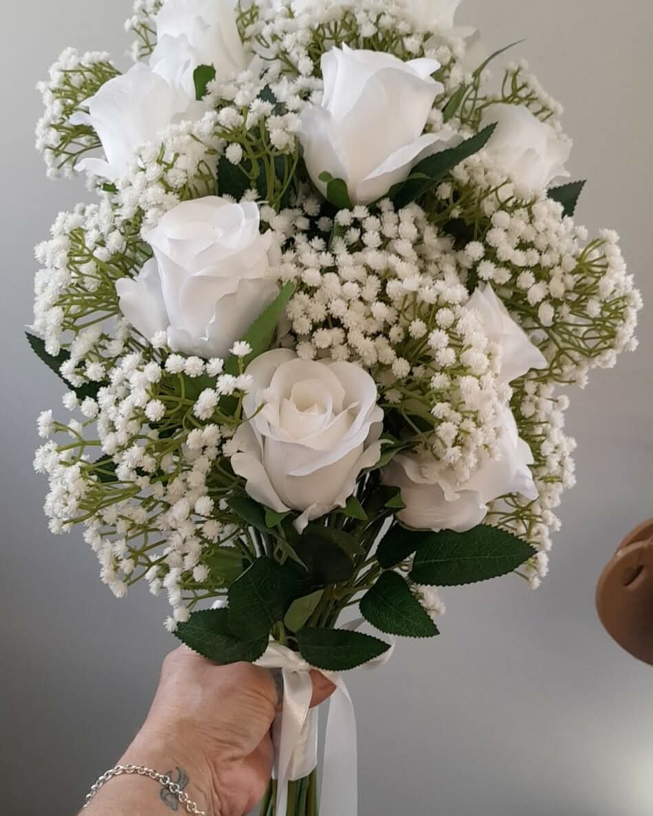 Ottilie bouquet aerial view - white roses and gypsophila with trailing white satin ribbon