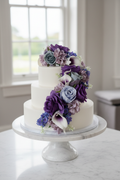 Blush and ivory cake garland on wedding cake