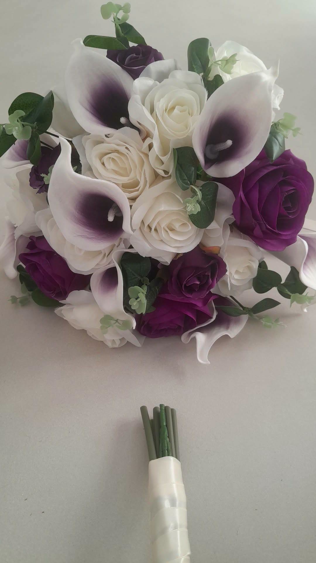 Isolde silk bridal bouquet with deep purple roses and white picasso calla lilies by Boutique Bouquets