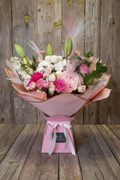 Pink bouquet on rustic wood