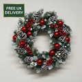 Red baubles and berries wreath with badge