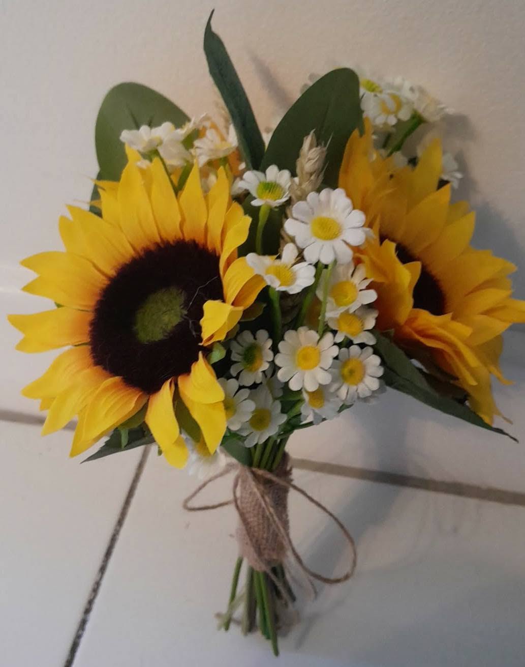 Thea artificial sunflower bridesmaid bouquets lined up with hessian wrap